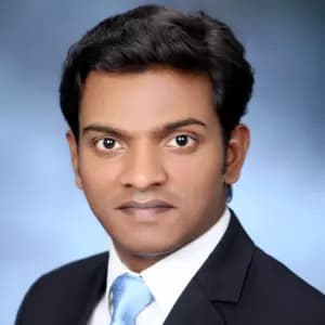 professional online Economics and Business tutor Deepak